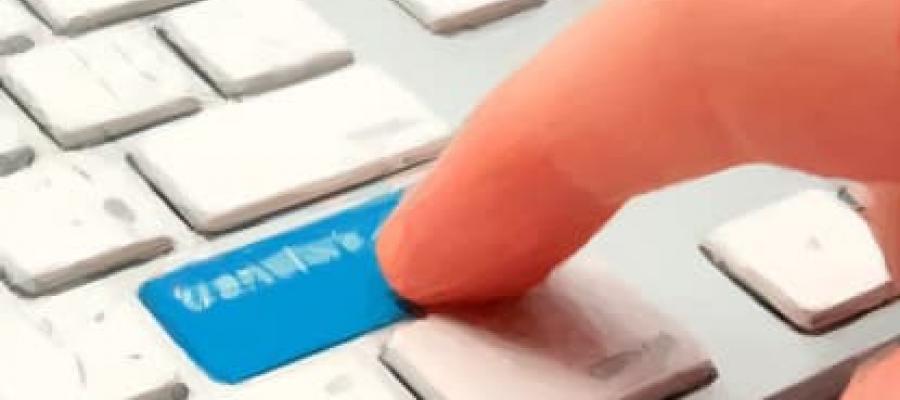 Finger pressing the transfer button on a keyboard